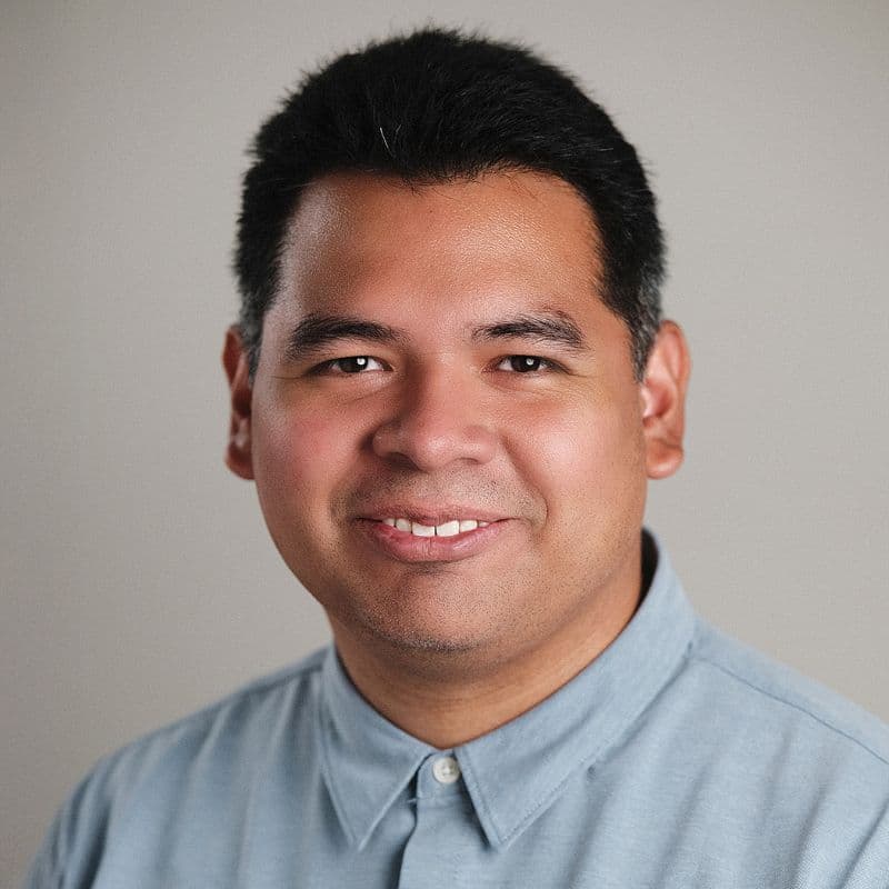 a man smiling for a picture