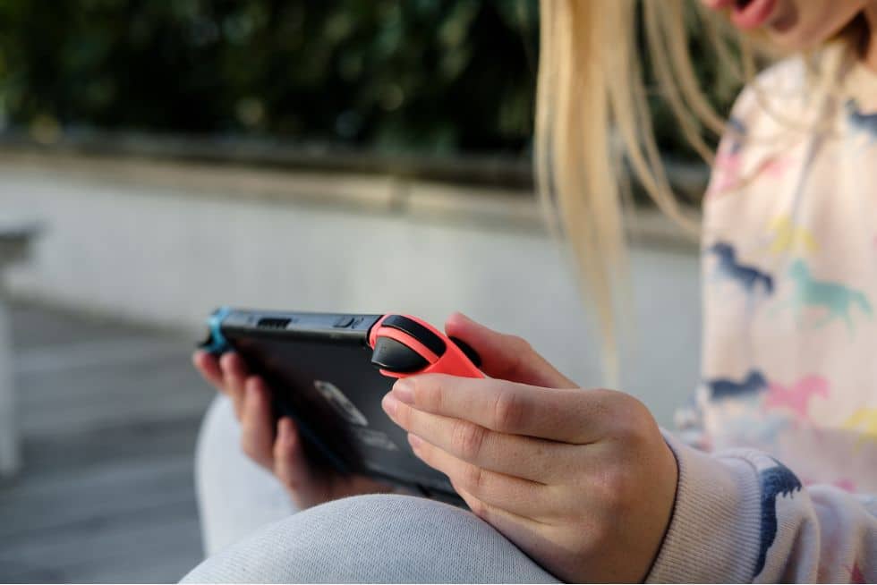 a woman holding a device